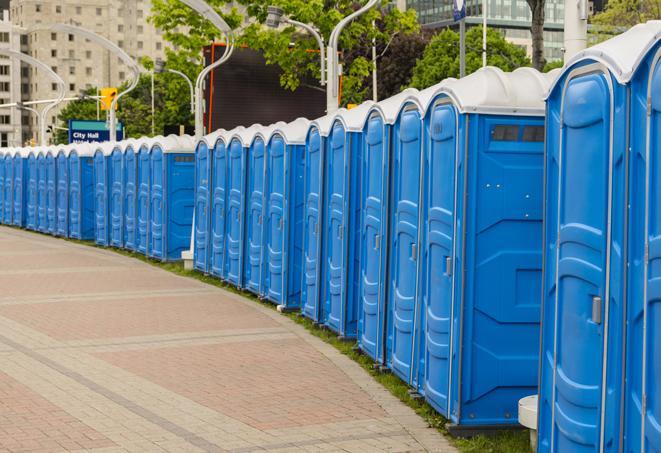 a line of brightly-colored portable restrooms, perfect for outdoor festivals and concerts in Boca Raton